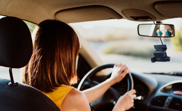 Woman driving car with an EverDriven camera