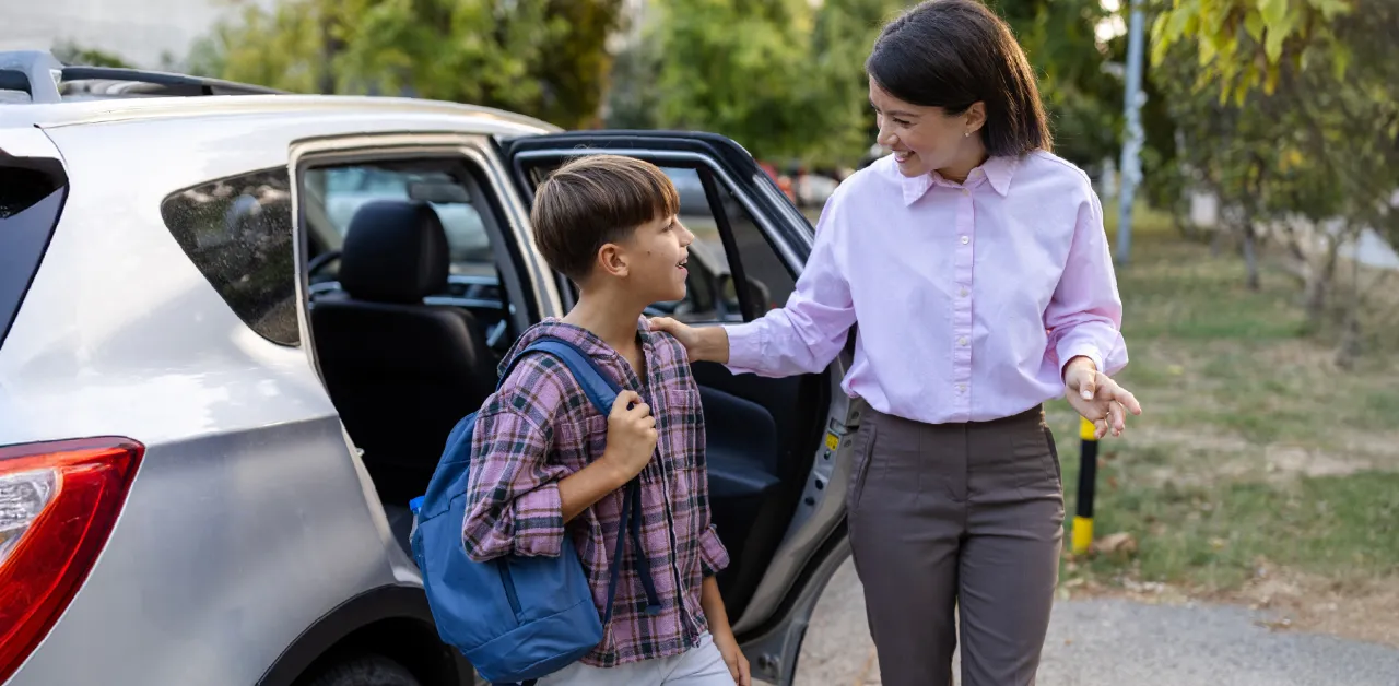 Parent and student during school drop-off with EverDriven support.