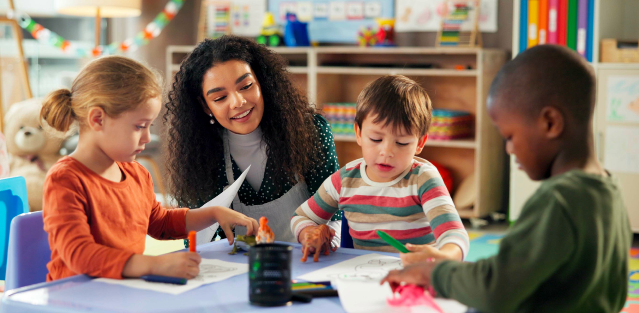 Teacher guiding young students in a classroom, highlighting access and equity in education