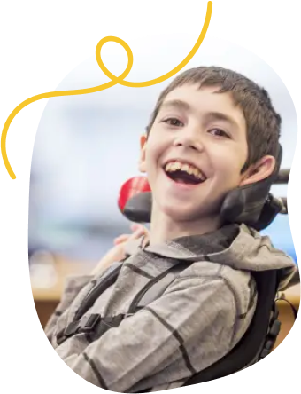 A teacher assists a smiling student in a wheelchair with building blocks, conveying warmth and support. Text: "Students on an IEP or 504 Plan."