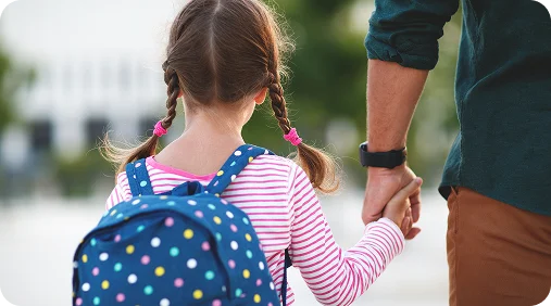 A man and a woman care for a child with disabilities.