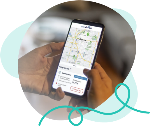 Person using the EverDriven VIP app for real-time student transportation tracking while driving