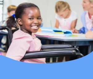 Smiling child in a wheelchair in a classroom setting with other children and a teacher in the background. Text reads, “FAQs About IEP Transportation Services.”
