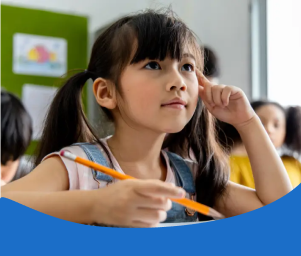 A young girl with a ponytail attentively listens in class, holding a pencil. Behind her, students engage in learning. Text: