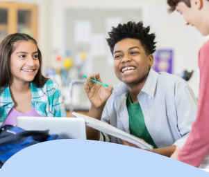 Two students smile while working with a teacher on a project in a classroom. The text reads, "Students with Out-of-District Placements."